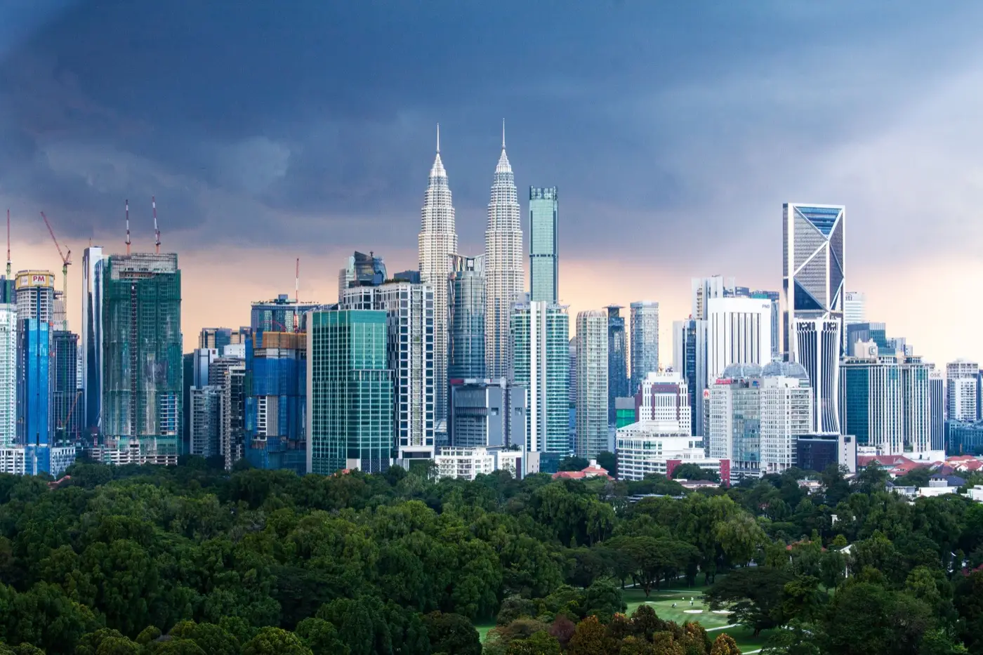 Kuala Lumpur financial district at dusk - tax-exempt remittance under MM2H